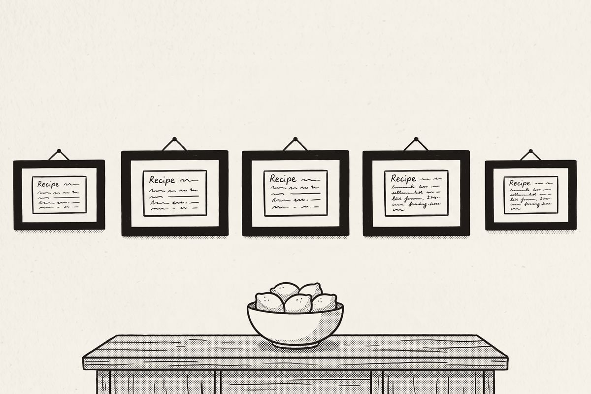 A gallery wall of five framed recipe cards above a sideboard.