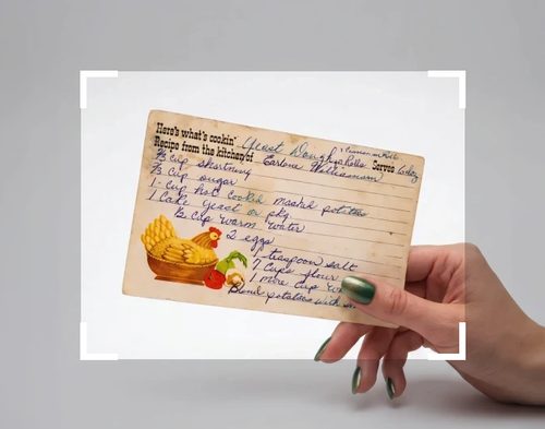 A recipe card photographed with a little background showing on every side, inside crop corners.